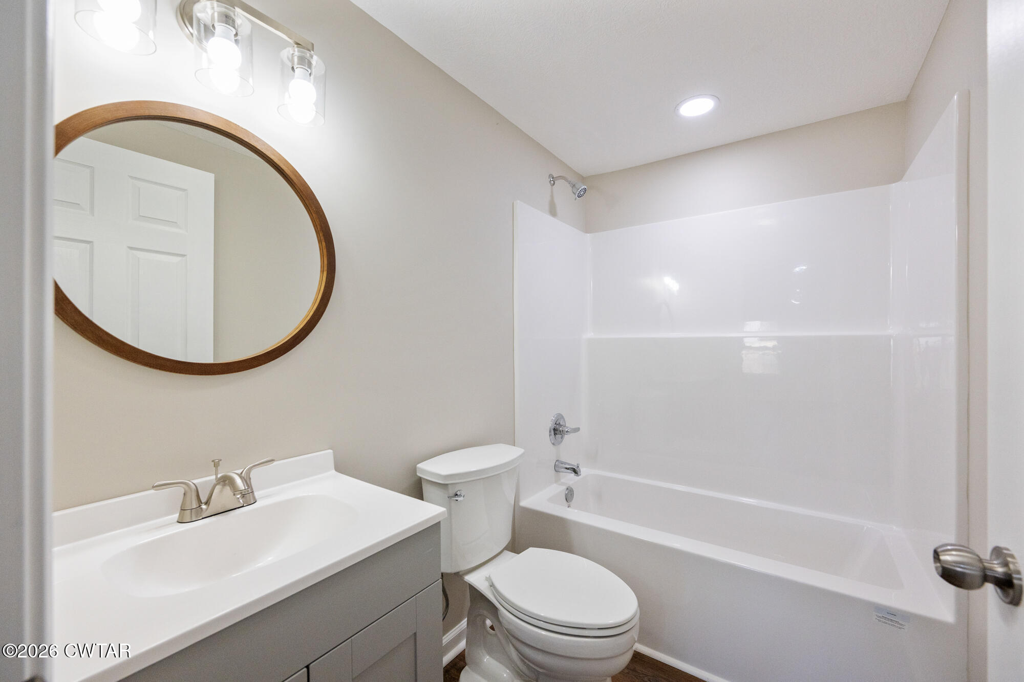 992 Greenway Road Huron, TN 38345 - Photo 15 of 17 a bathroom with a sink a toilet and a mirror