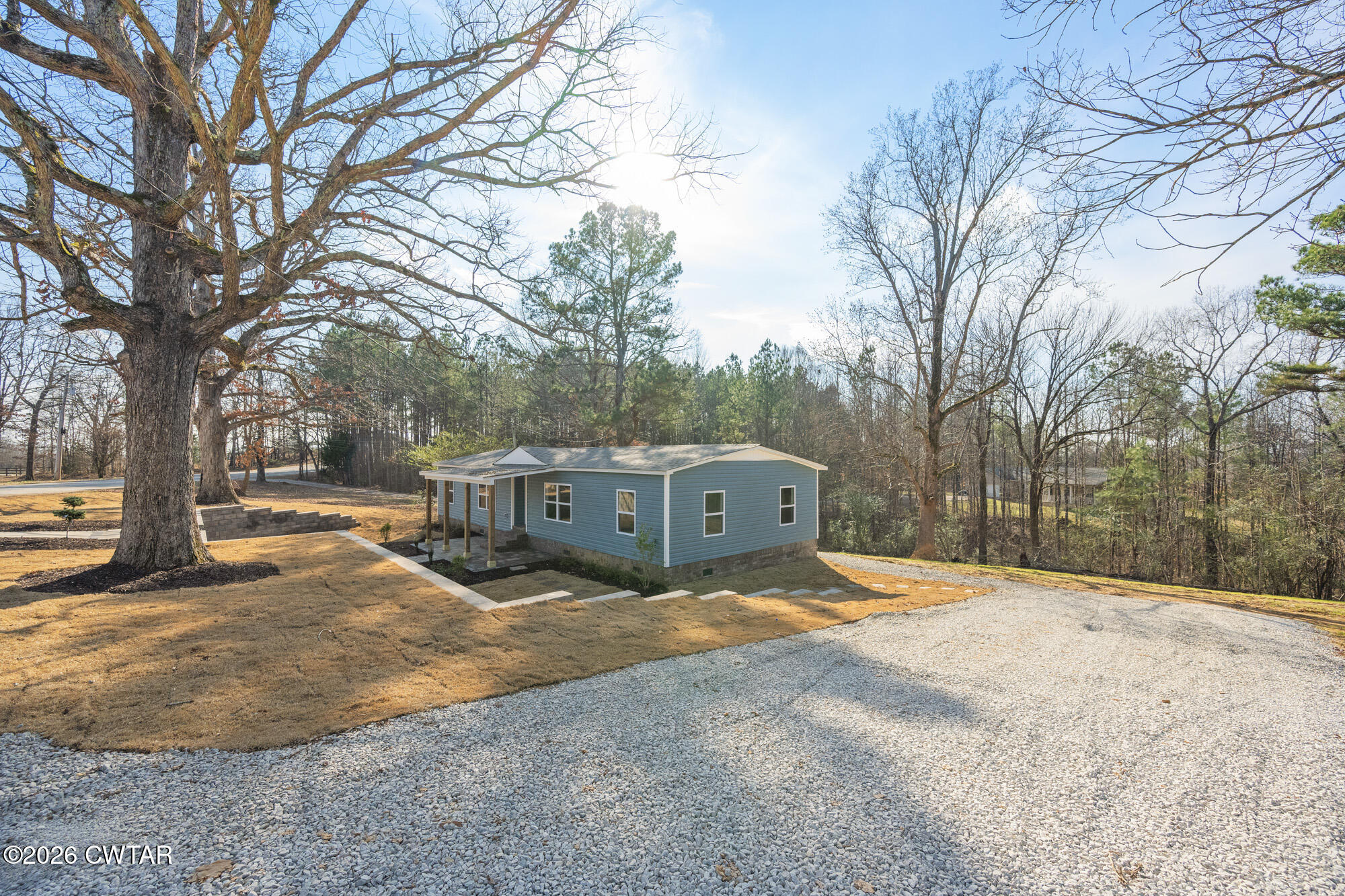 992 Greenway Road Huron, TN 38345 - Photo 4 of 17 a view of a yard with large trees