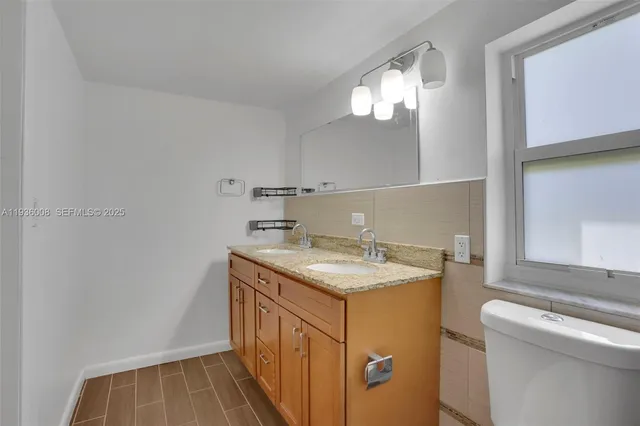 a utility room with sink dryer and washer