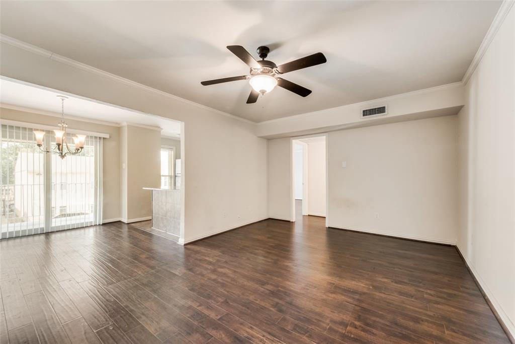 4658 Matilda Street, Unit E Dallas, TX 75206 - Photo 1 of 1 a view of an empty room with wooden floor and a window