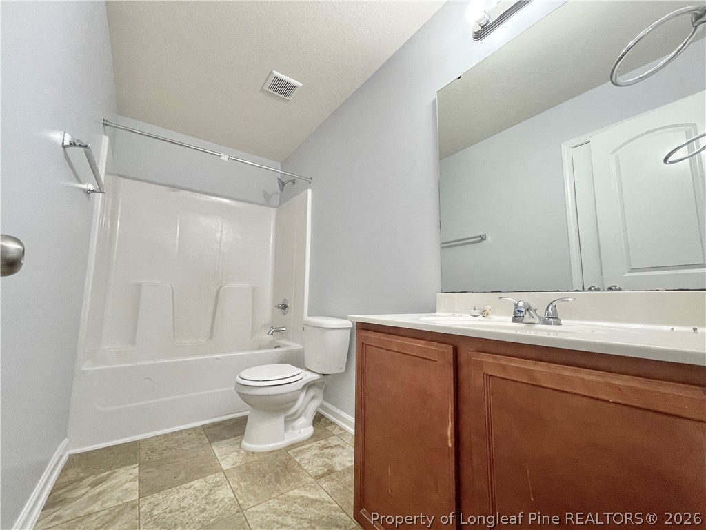 92 Hallow Oak Street Spring Lake, NC 28390 - Photo 8 of 11 a bathroom with a sink toilet and shower