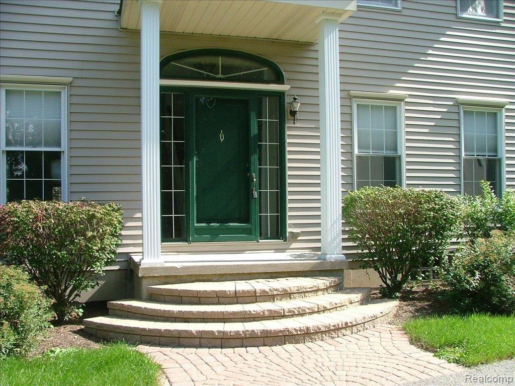 4830 Fenton Road Hartland, MI 48353 - Photo 2 of 12 Front Entry with Pavers