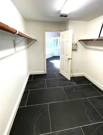 a view of a black space & utility room