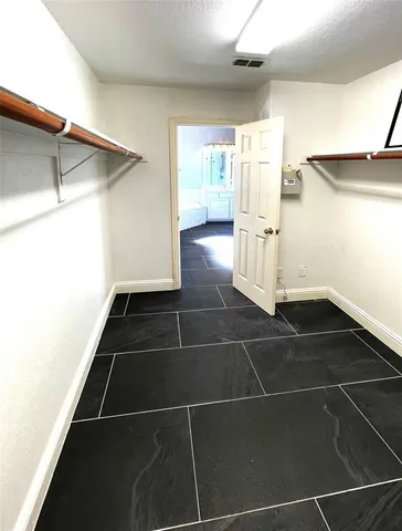 a view of a black space & utility room