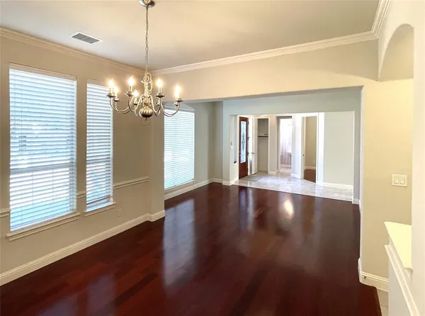a view of a room with window and wooden floor