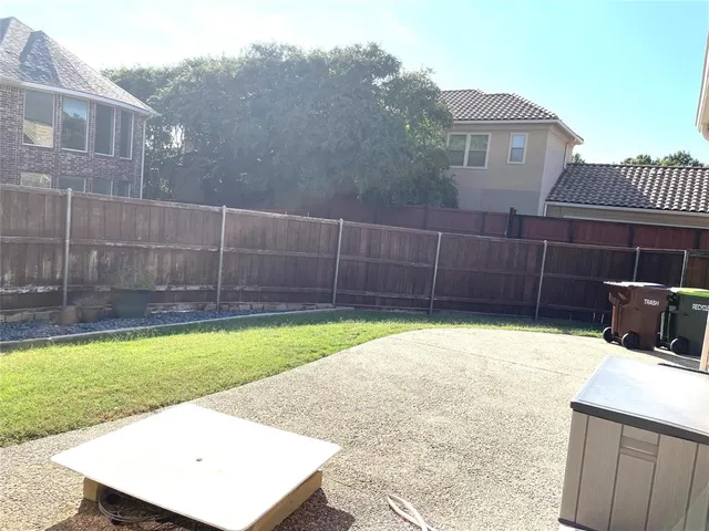 a view of a backyard with sitting area