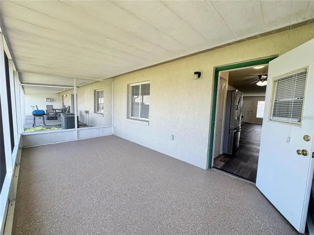 a view of an empty room with glass door
