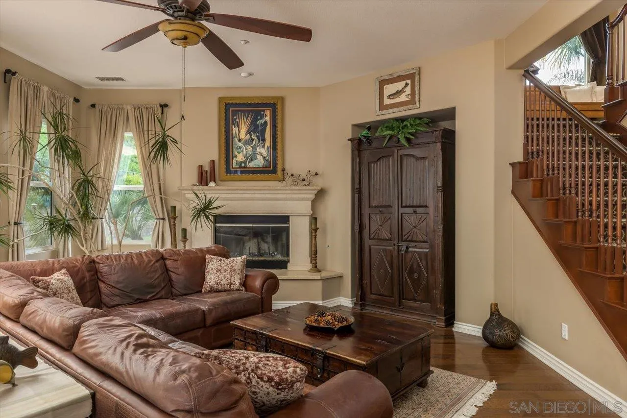 1505 Chateau Lafite Bonsall, CA 92003 - Photo 12 of 47 a living room with furniture and a fireplace