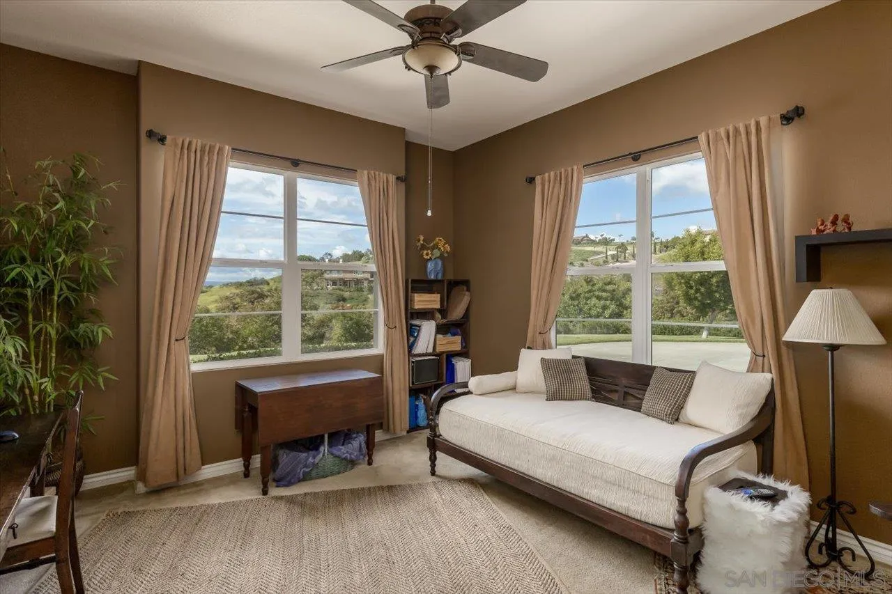 1505 Chateau Lafite Bonsall, CA 92003 - Photo 18 of 47 a living room with furniture and a window
