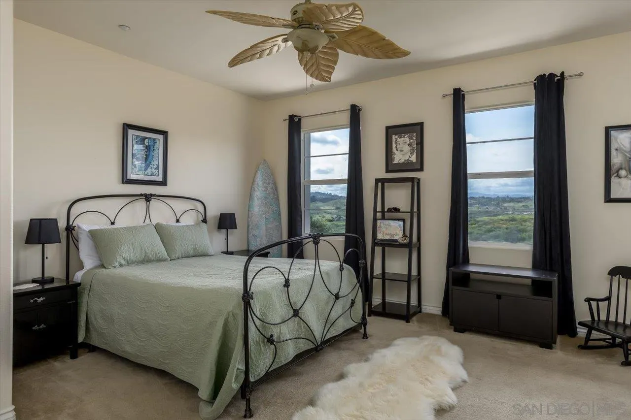 1505 Chateau Lafite Bonsall, CA 92003 - Photo 26 of 47 a bedroom with a bed and window