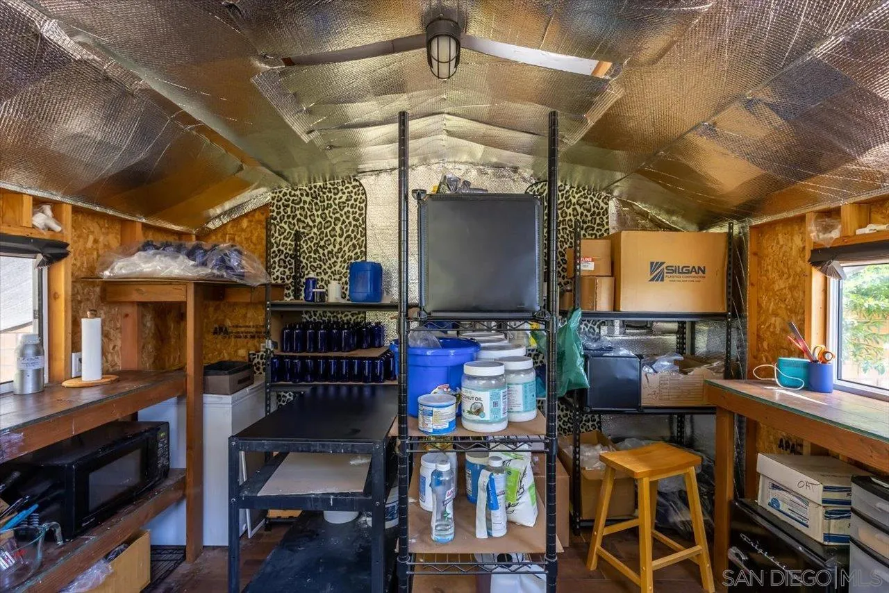 1505 Chateau Lafite Bonsall, CA 92003 - Photo 29 of 47 a view of a dining room with furniture window and wooden floor