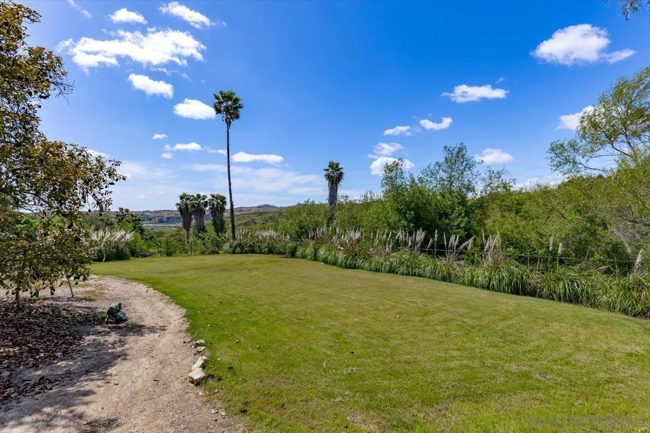 1505 Chateau Lafite Bonsall, CA 92003 - Photo 33 of 47 a view of a grassy field with an tree
