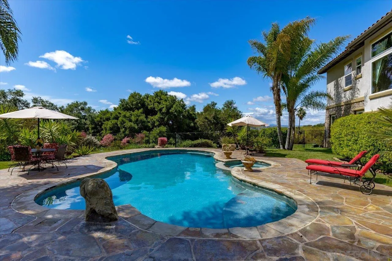 1505 Chateau Lafite Bonsall, CA 92003 - Photo 34 of 47 a view of a swimming pool with sitting area