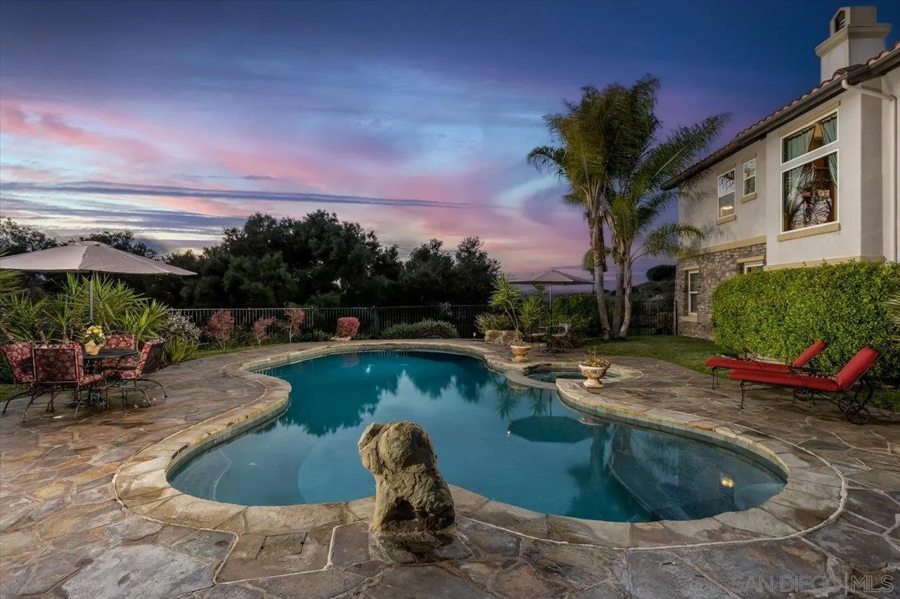 1505 Chateau Lafite Bonsall, CA 92003 - Photo 4 of 47 a view of a swimming pool with a patio