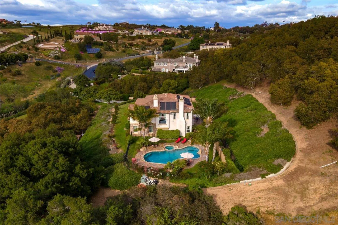 1505 Chateau Lafite Bonsall, CA 92003 - Photo 45 of 47 an aerial view of residential houses with outdoor space and parking