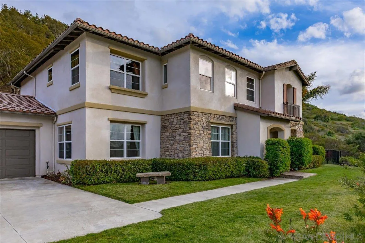 1505 Chateau Lafite Bonsall, CA 92003 - Photo 5 of 47 a front view of a house with a yard