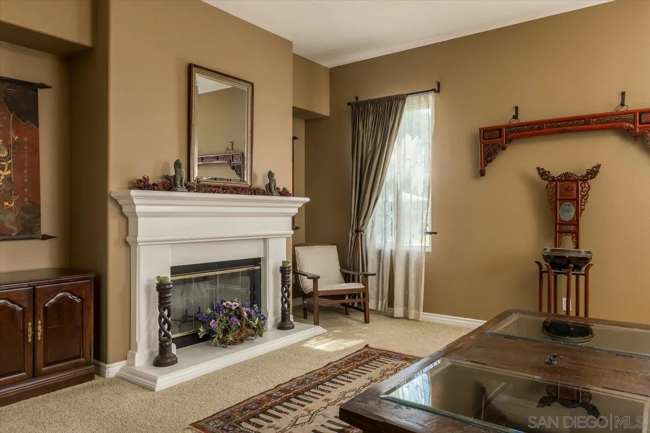 1505 Chateau Lafite Bonsall, CA 92003 - Photo 8 of 47 a living room with furniture and a fireplace