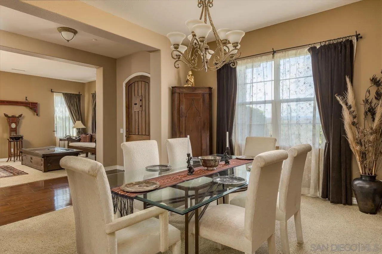 1505 Chateau Lafite Bonsall, CA 92003 - Photo 10 of 47 a view of a dining room with furniture window and outside view