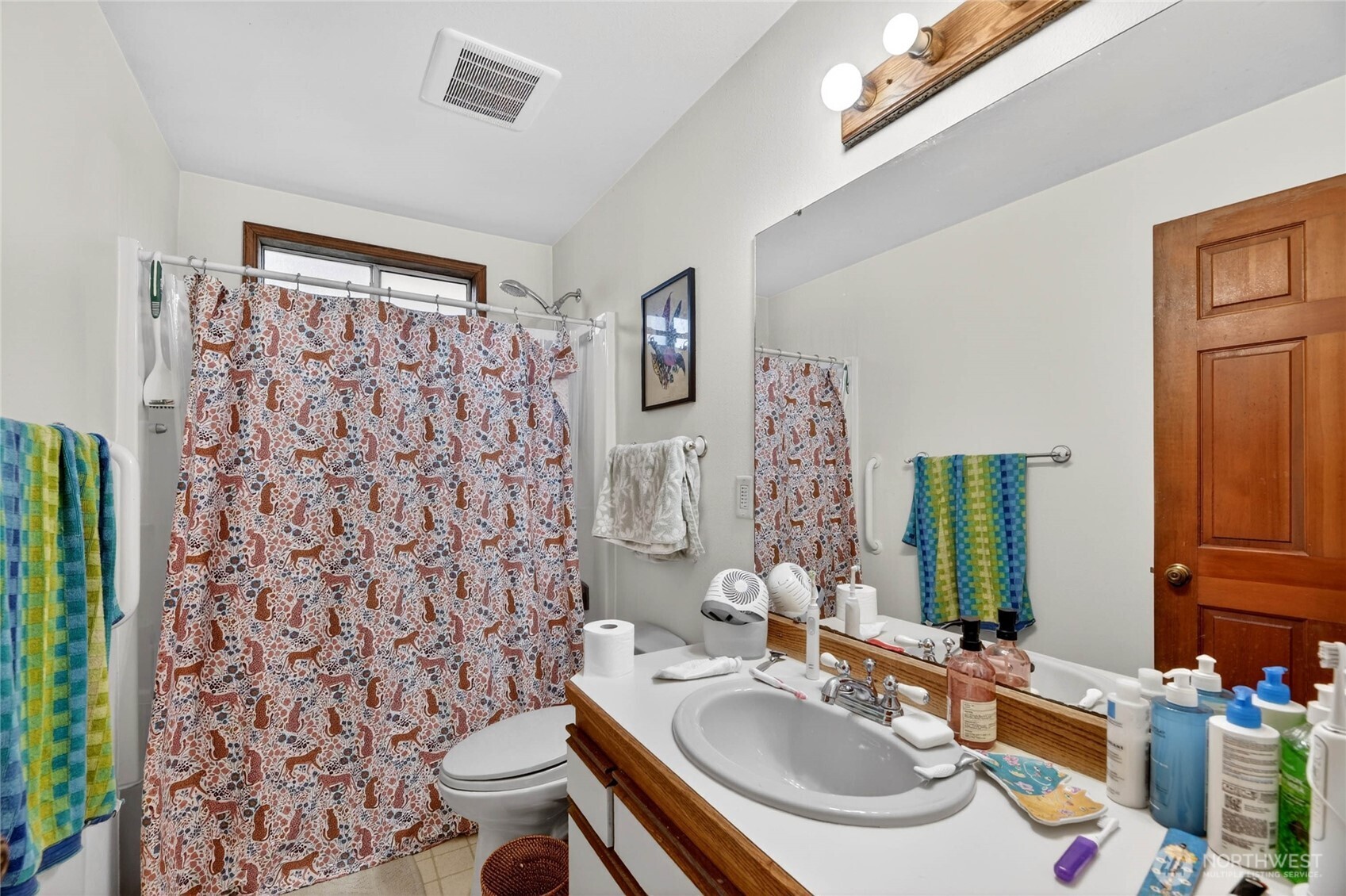2434 55th Avenue Southwest Seattle, WA 98116 - Photo 11 of 40 a bathroom with a sink toilet and shower