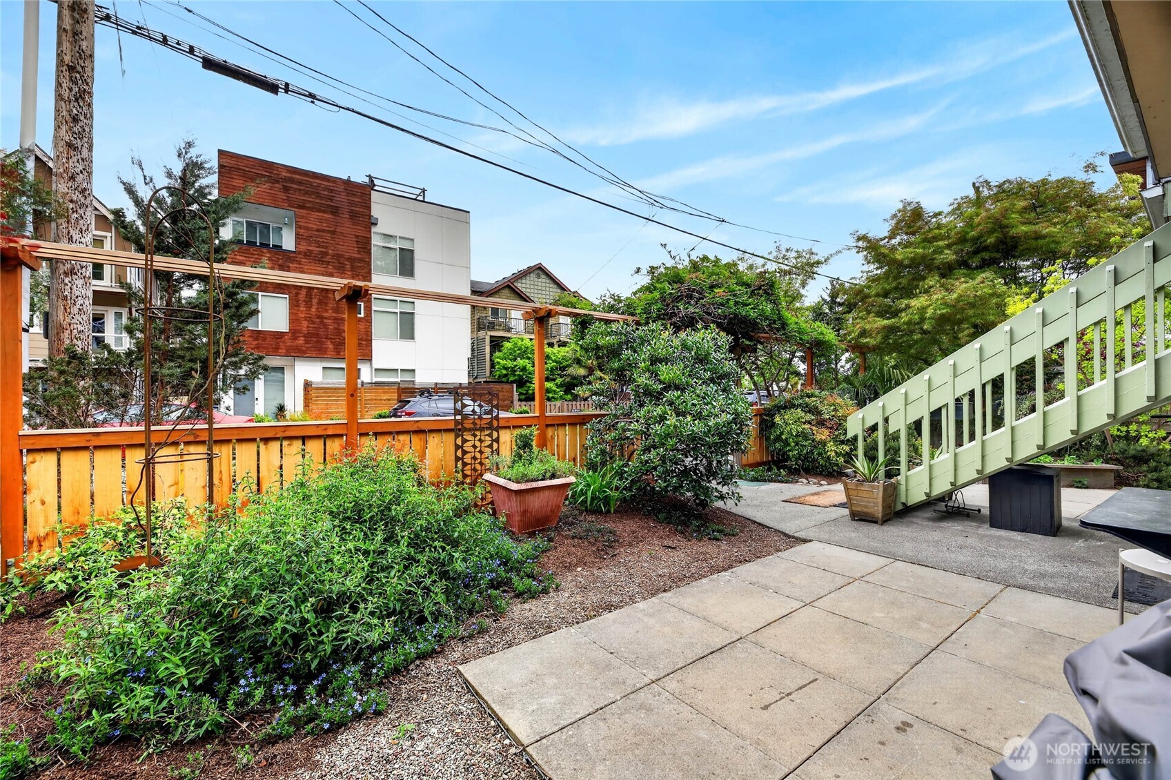 2434 55th Avenue Southwest Seattle, WA 98116 - Photo 13 of 40 a view of a garden with lawn chairs
