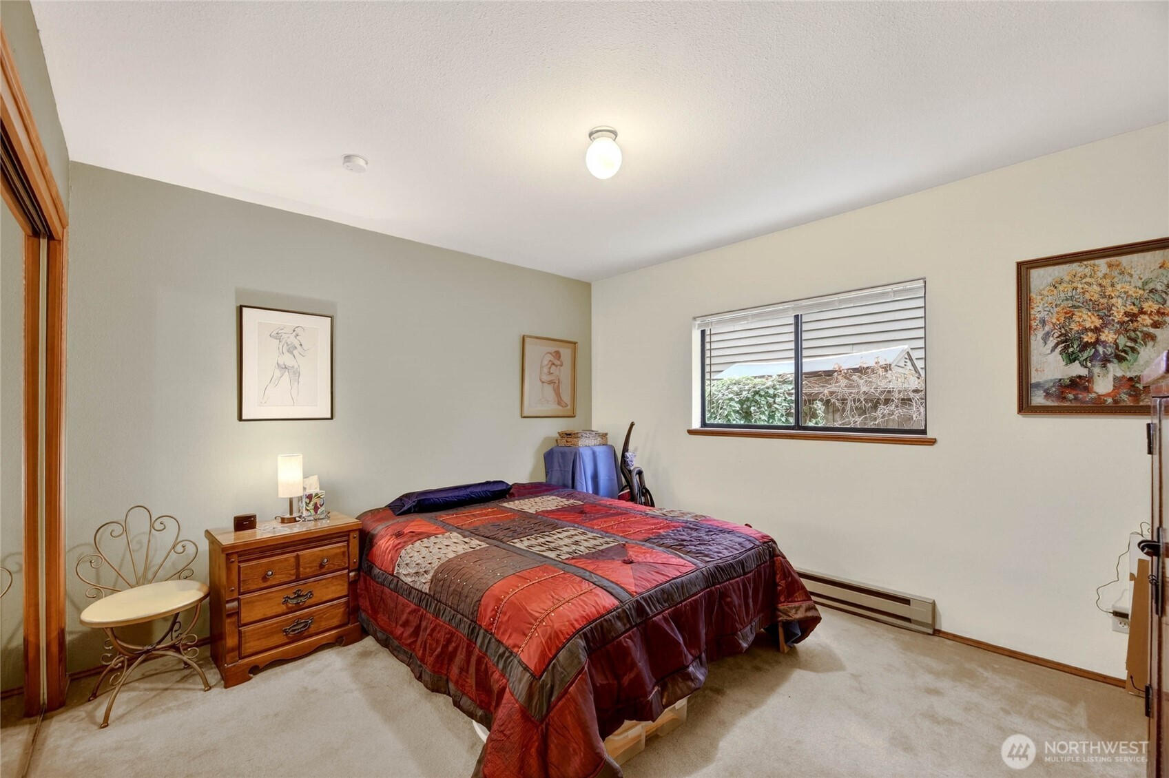 2434 55th Avenue Southwest Seattle, WA 98116 - Photo 20 of 40 a bedroom with a bed and painting on the wall