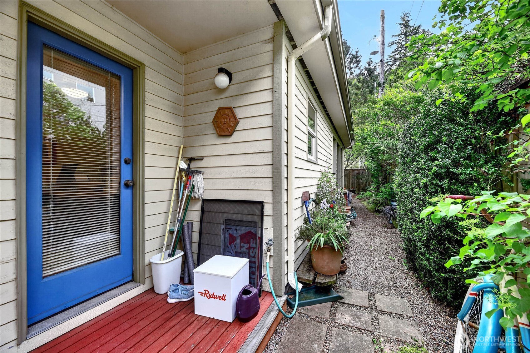 2434 55th Avenue Southwest Seattle, WA 98116 - Photo 23 of 40 a view of a patio with couches table and chairs and potted plants