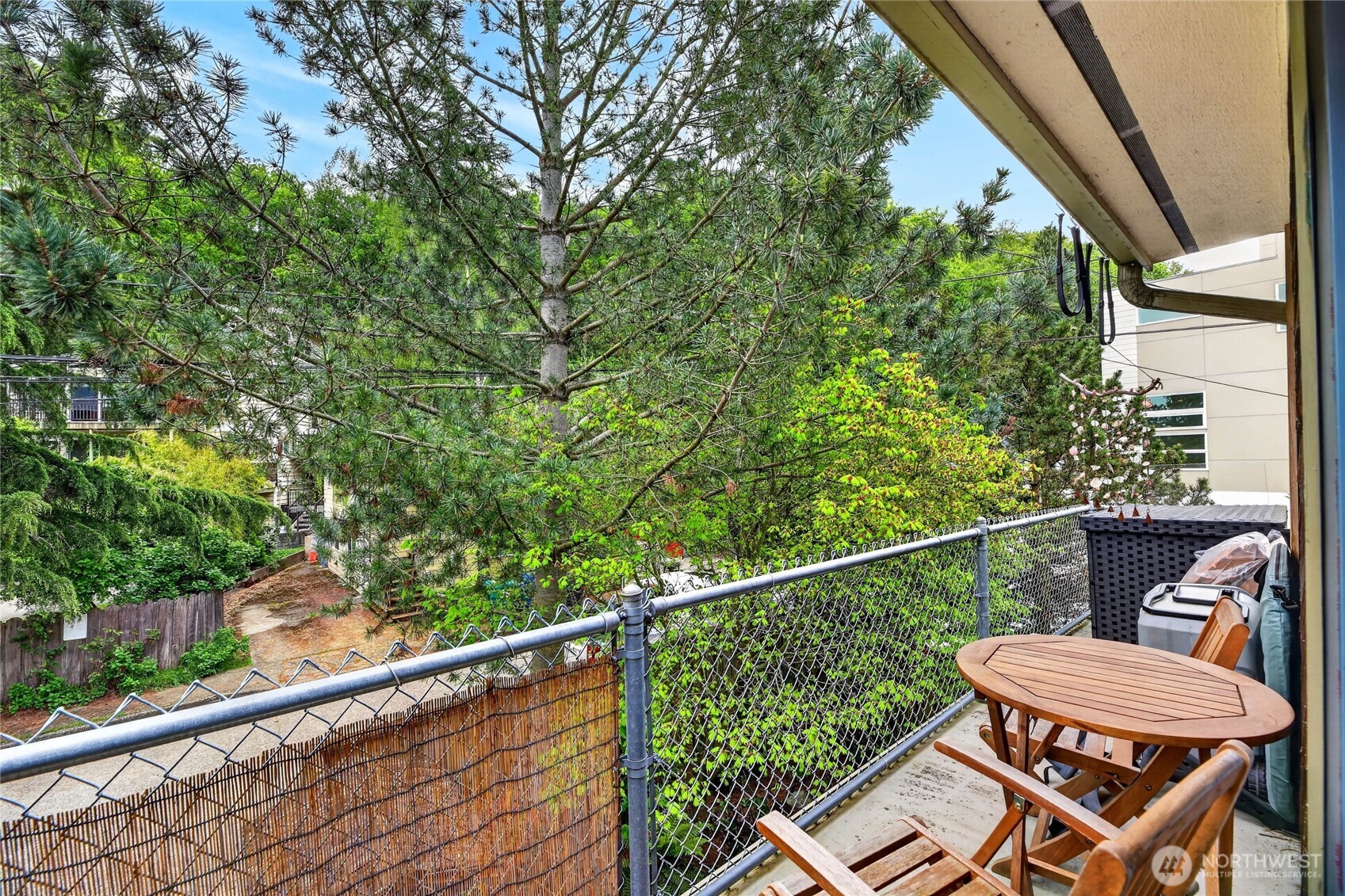 2434 55th Avenue Southwest Seattle, WA 98116 - Photo 34 of 40 a view of a chair and table in the balcony