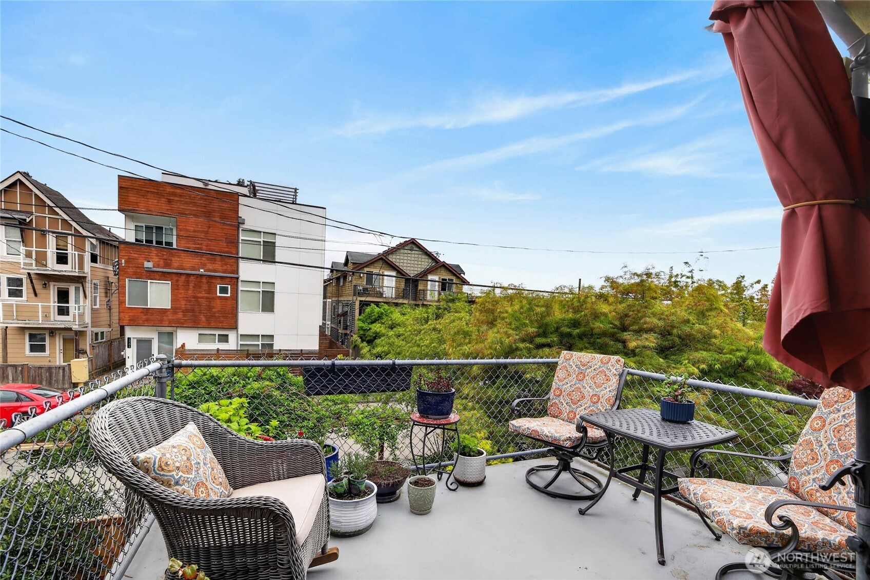 2434 55th Avenue Southwest Seattle, WA 98116 - Photo 37 of 40 a balcony with table and chairs