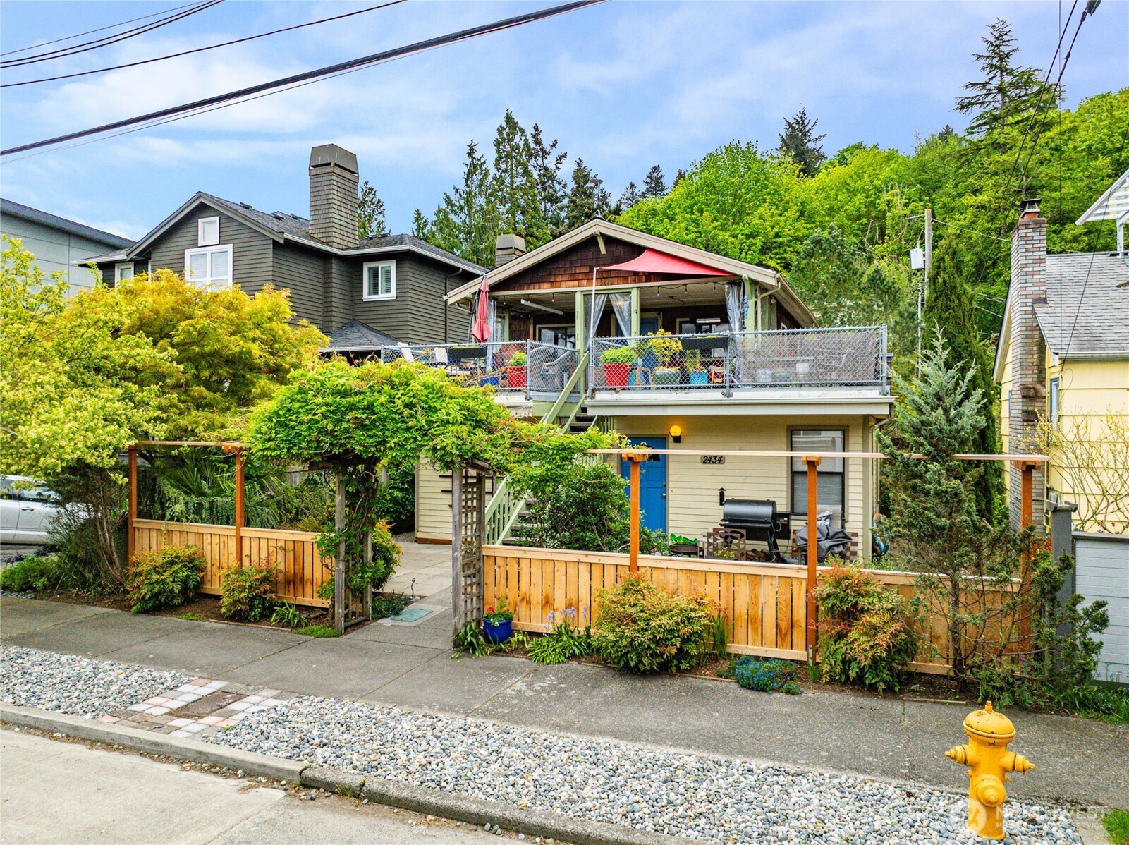 2434 55th Avenue Southwest Seattle, WA 98116 - Photo 38 of 40 a front view of a house with a yard
