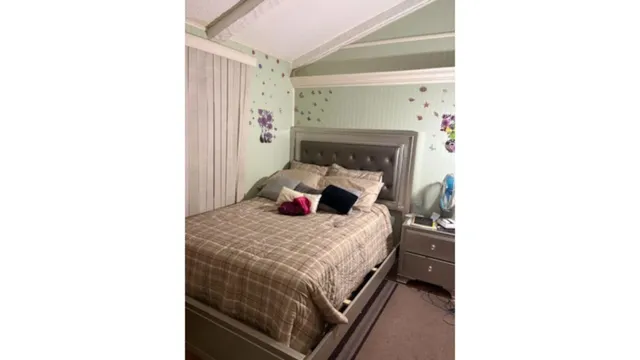 a bedroom with a stove and a window