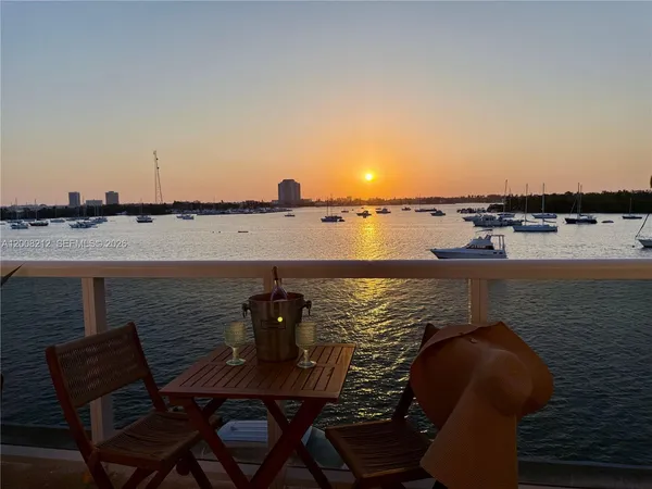 a view of a chairs and table on the deck