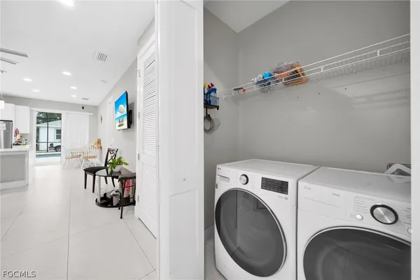 a view of storage and utility room with washer and dryer