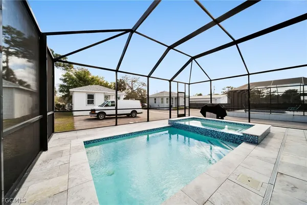 a view of a swimming pool with a porch
