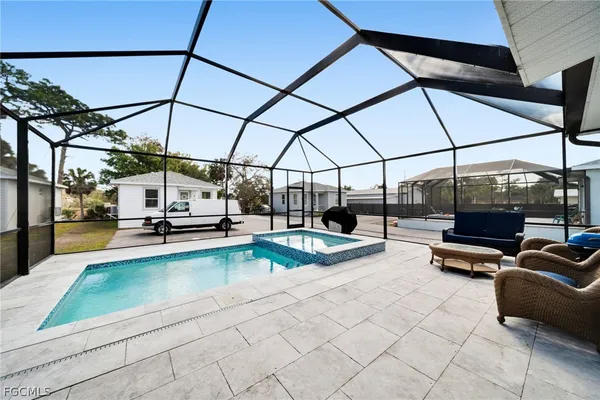 a view of a swimming pool with a patio