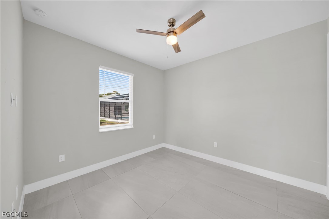 26951 North Riverside Drive Bonita Springs, FL 34135 - Photo 37 of 50 an empty room with a window and a fan