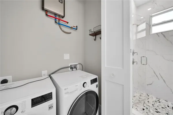 a utility room with dryer and washer