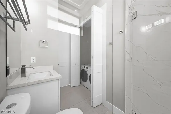 a bathroom with a sink and toilet