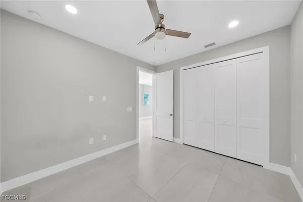 a view of a livingroom with a chandelier fan