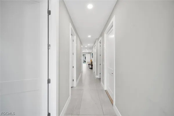 a view of a hallway with a white walls