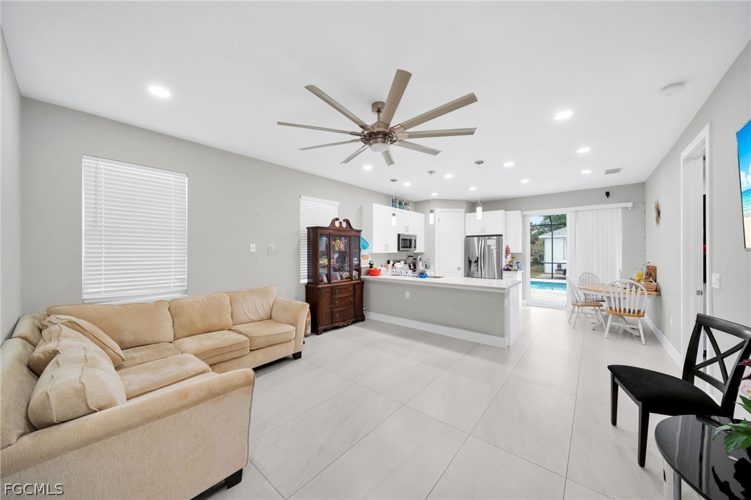 26951 North Riverside Drive Bonita Springs, FL 34135 - Photo 9 of 50 a living room with furniture and a view of kitchen