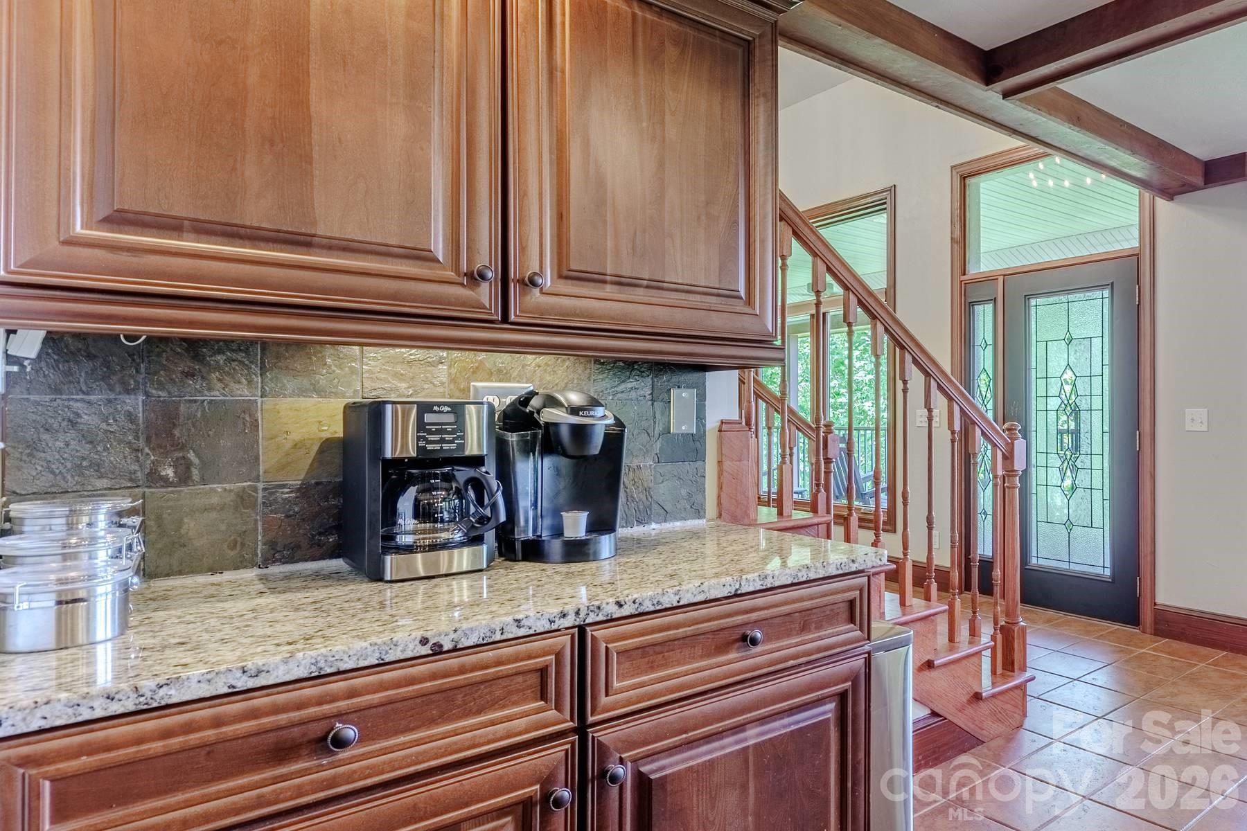 860 Butternut Ridge, Unit 8 Bryson City, NC 28713 - Photo 13 of 47 a kitchen with stainless steel appliances granite countertop a sink and cabinets
