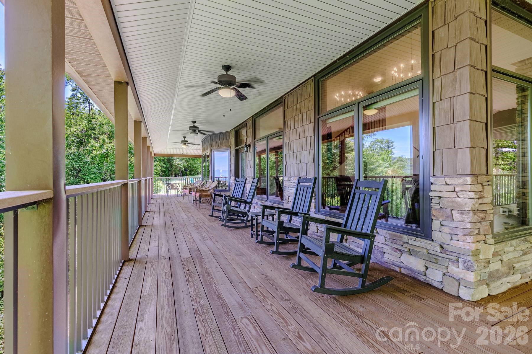 860 Butternut Ridge, Unit 8 Bryson City, NC 28713 - Photo 41 of 47 a view of a porch with furniture and wooden floor