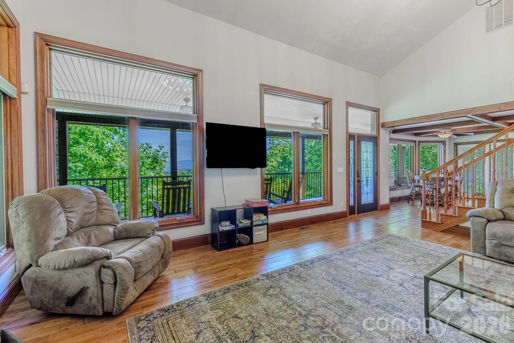 860 Butternut Ridge, Unit 8 Bryson City, NC 28713 - Photo 6 of 47 a living room with furniture and a large window