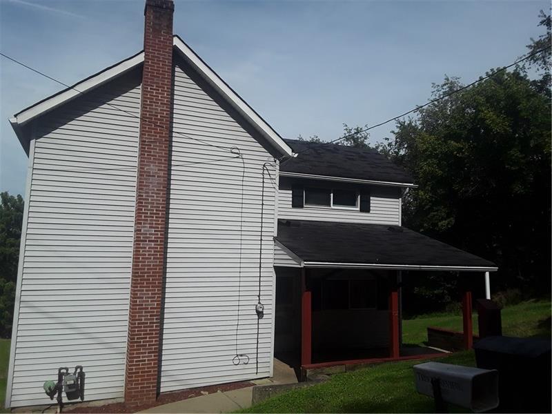 3300 Old Spring Road Ardara, PA 15615 - Photo 2 of 24 Relax on the front porch, just off the kitchen.