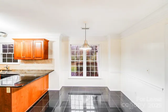 a view of a kitchen with a sink and a window