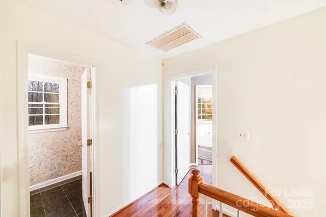 a view of a hallway with windows