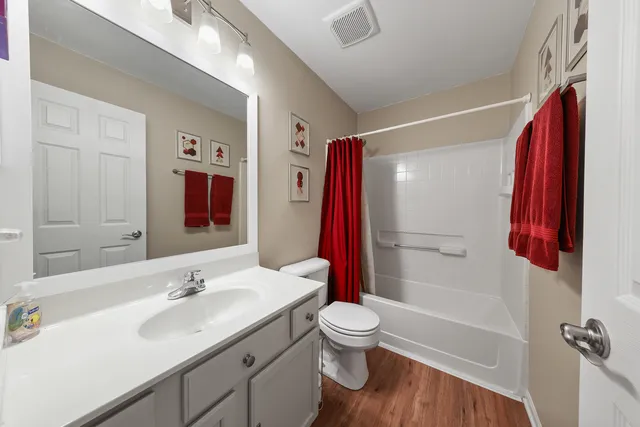 a bathroom with a sink toilet and shower