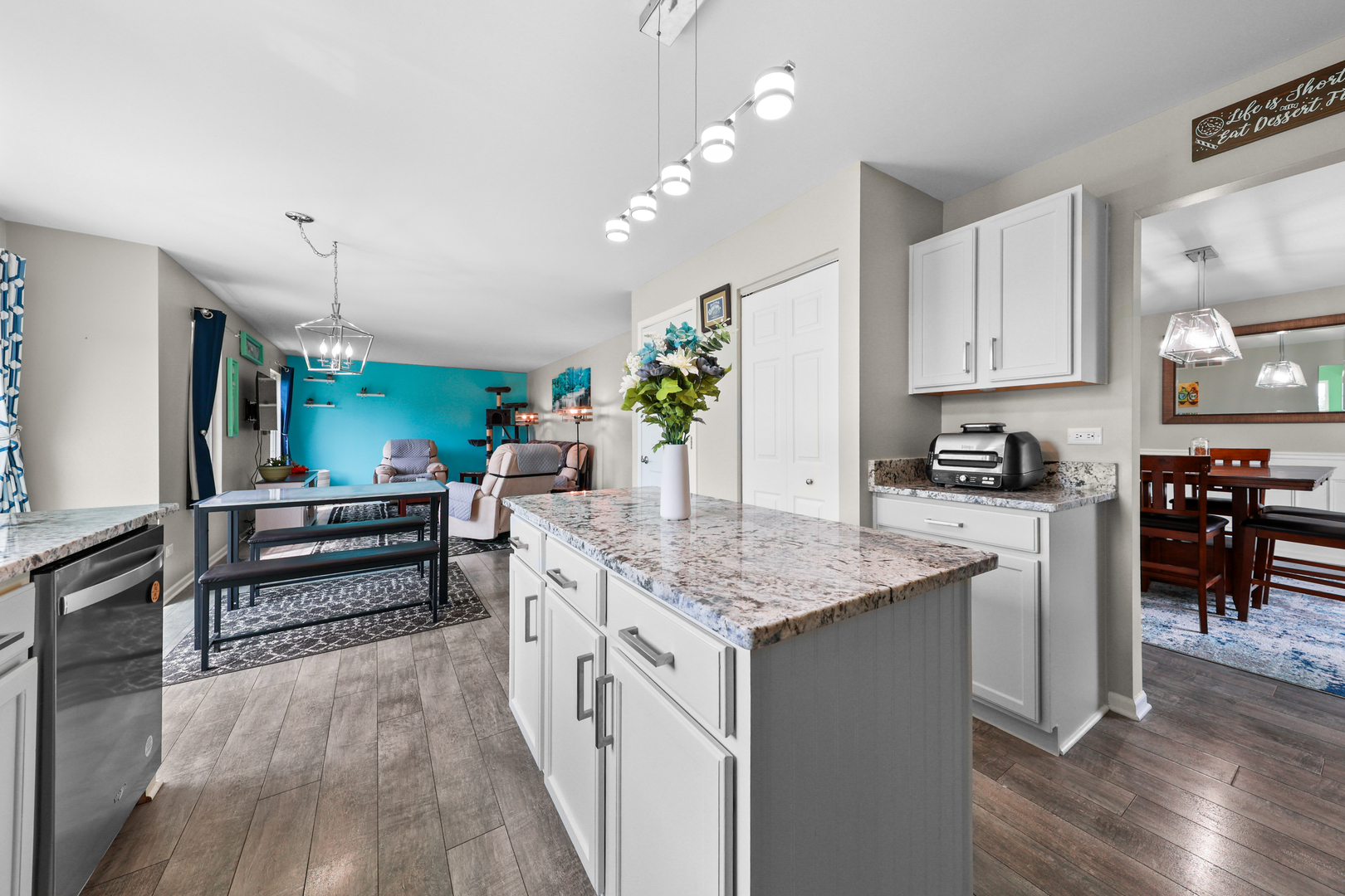 1468 Sedge Pass Minooka, IL 60447 - Photo 5 of 19 a kitchen with stainless steel appliances kitchen island granite countertop a stove a sink and a refrigerator