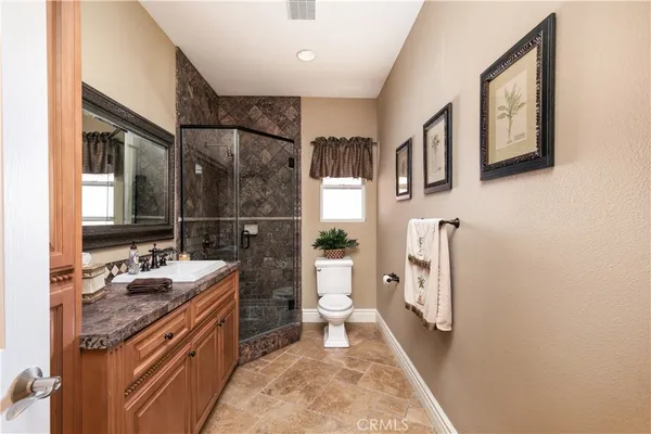 a living room with furniture and large windows