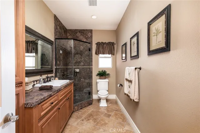 a living room with furniture and large windows